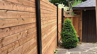 Horizontal privacy Wood fence with Dark Brown vinyl posts
