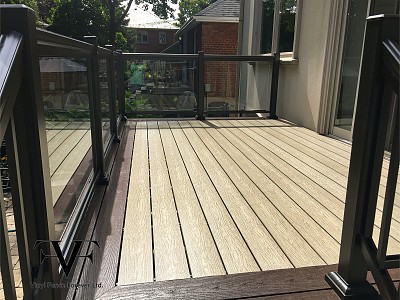 Tan and Commercial brown, vinyl deck with glass railing