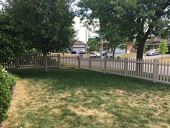 White vinyl Cape Cod picket fence