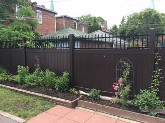 Brown Privacy Fence with Aluminum Topping