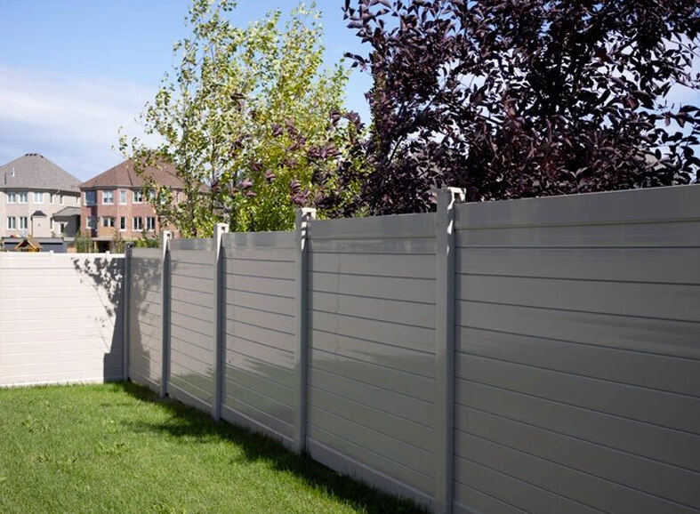 Vinyl fence installed around front yard garden of Toronto home